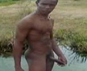 Horny black gay masturbating in the river